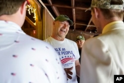 FILE - Pennsylvania state Sen. Doug Mastriano, R-Franklin, a Republican running for Governor of Pennsylvania, greets a supporter at a campaign stop in Portersville, Pa., May 10, 2022.