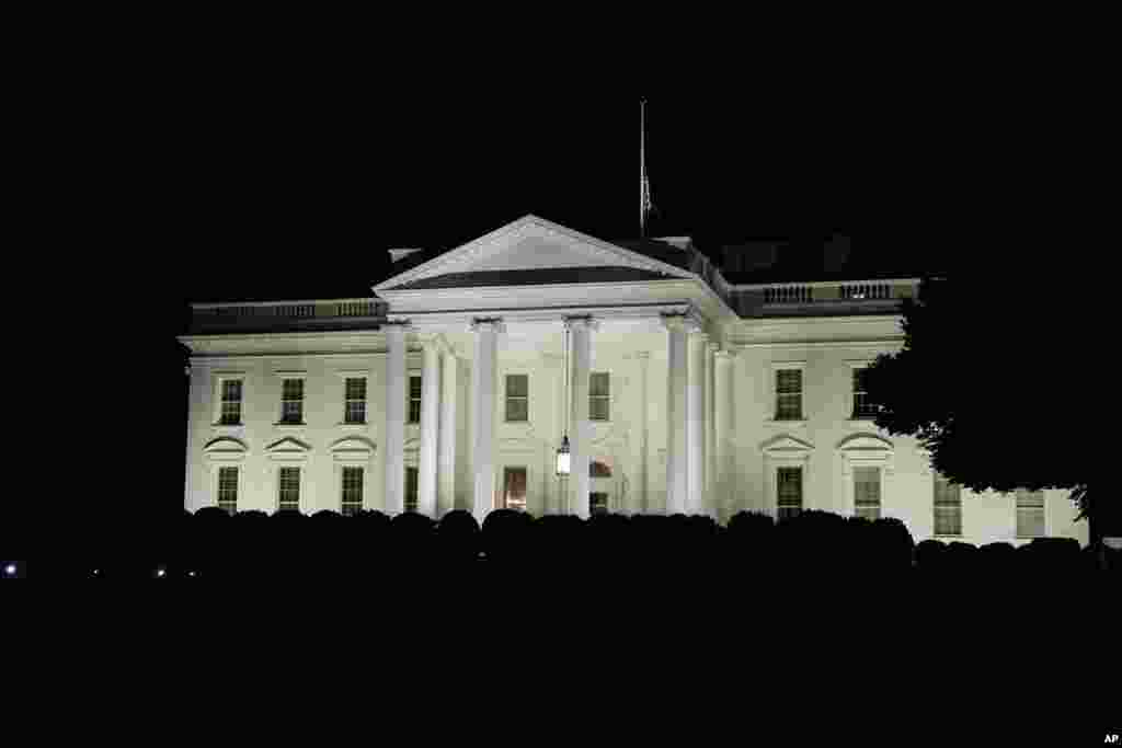 The American flag flies at half staff on the White House after President Joe Biden spoke about the mass shooting at Robb Elementary School in Uvalde, Texas, from the White House, May 24, 2022. 