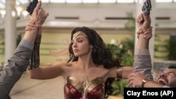 This image released by Warner Bros. Entertainment shows Gal Gadot in a scene from "Wonder Woman 1984." (Clay Enos/Warner Bros. Entertainment via AP)