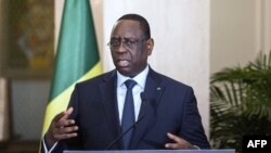 Senegal's President Macky Sall, who currently heads the African Union, speaks during a press conference in Dakar, May 1, 2022.
