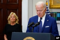 President Joe Biden pauses as he speaks about the mass shooting at Robb Elementary School in Uvalde, Texas, from the Roosevelt Room at the White House, in Washington, Tuesday, May 24, 2022, as first lady Jill Biden listens. (AP Photo/Manuel Balce Ceneta)