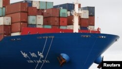 A worker is seen on the bow of a container ship docked inside Botany Bay in Sydney, Australia, Oct. 28, 2020. 