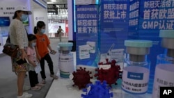 More than two years into the pandemic, China has not approved the more effective mRNA vaccines, instead choosing to pursue its own route on COVID-19 vaccines. (AP Photo/Ng Han Guan)