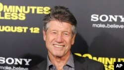 FILE - Fred Ward, a cast member in '30 Minutes or Less,' poses at the premiere of the film in Los Angeles on Aug. 8, 2011. 