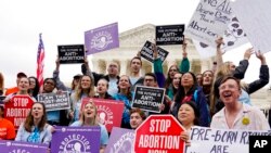 Demonstrators protest outside of the US Supreme Court, May 16, 2022, in Washington.