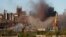 FILE - Smoke rises from the Metallurgical Combine Azovstal in Mariupol during shelling, in Mariupol, in eastern Ukraine, May 7, 2022.
