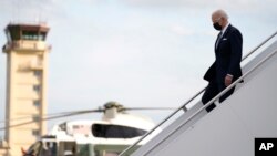 U.S. President Joe Biden disembarks from Air Force One on his arrival at Yokota Air Base, in Fussa, on the outskirt of Tokyo, Japan, May 22, 2022.