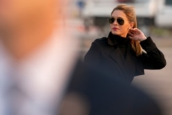 FILE - In this Sept. 12, 2020, file photo, Counselor to the President Hope Hicks arrives with President Donald Trump at Reno-Tahoe International Airport in Reno, Nev.