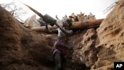 Letoyie Leroshi, a Samburu man gives cows water from a well in Kom village, Samburu County, Kenya, on Saturday, Oct. 15, 2022. (AP Photo/Brian Inganga)