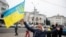 FILE - Ukrainians gather in downtown to celebrate the recapturing of their city Kherson, Ukraine, Saturday, Nov. 12, 2022. (AP Photo/Yevhenii Zavhorodnii)