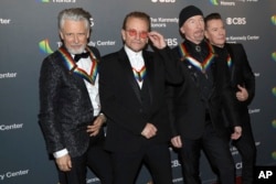 2022 Kennedy Center Honorees, from left, Adam Clayton, Bono, The Edge and Larry Mullen Jr. of U2 arrive at the Kennedy Center Honors on Sunday, Dec. 4, 2022, at The Kennedy Center in Washington. (Photo by Greg Allen/Invision/AP)