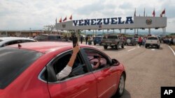 A traveler takes a photo of the Tienditas International Bridge in San Antonio, Tachira state, Venezuela, Jan. 1, 2023. Colombia and Venezuela on Sunday opened the bridge that was finished in 2016 but never inaugurated because of years of political tensions.