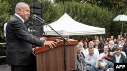 Israel's prime minister-designate Benjamin Netanyahu speaks during the funeral of Israeli Orthodox Jewish rabbi Haim Drukman, a spiritual leader of the nationalist Religious Orthodox Jewish movement, at Merkaz Shapira near Kiryat Malachi on Dec. 26, 2022.