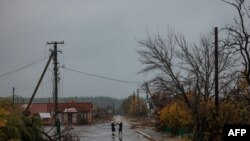 Local residents meet in Yampil, Ukraine, on Oct. 26, 2022. The city in the eastern Luhansk region — which Moscow claimed to have annexed along with three other Ukrainian regions — has been the scene of intense fighting in recent days. 