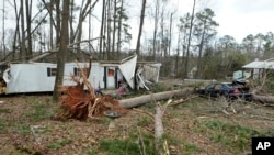 A storm-damaged home is shown, Jan. 13, 2023, in Jackson, Ga. Powerful storms spawned tornadoes across Georgia late on Jan. 12, 2023.