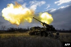 Ukrainian servicemen fire with a CAESAR self-propelled howitzer towards Russian positions in eastern Ukraine, Dec. 28, 2022.