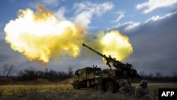 Ukrainian servicemen fire with a CAESAR self-propelled howitzer towards Russian positions in eastern Ukraine, Dec. 28, 2022. 