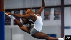Fisk University gymnast Jordynn Cromartie performs her floor exercise routine during a team practice at the Nashville Gymnastics Training Center on Dec. 28, 2022, in Nashville, Tenn.