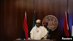 Nigerian President Muhammadu Buhari speaks during the launch of the new Nigerian currency in Abuja, Nigeria November 23, 2022. 