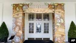 The entrance to the East Wing of the White House is decorated for the holiday season during a press preview of holiday decorations at the White House, Nov. 28, 2022, in Washington. 