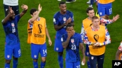 U.S. players react at the end of the World Cup group B soccer match between Iran and the United States at the Al Thumama Stadium in Doha, Qatar, Nov. 30, 2022.