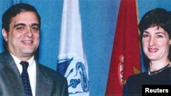 FILE - An undated Department of Defense image shows Ana Belen Montes receiving a national intelligence certificate of distinction from George Tenet, who served as director of central intelligence for the CIA