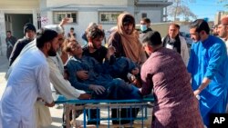 A man injured by the Afghan forces shelling is brought to hospital for treatment in Chaman, southwestern Pakistan along the Afghan border, Dec. 15, 2022. 