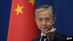 FILE - Chinese Foreign Ministry spokesman Wang Wenbin takes a question during a Foreign Ministry briefing in Beijing on Nov. 9, 2020. 