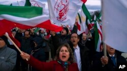 FILE - Demonstrators march past the U.S. Capitol in Washington during a Dec. 17, 2022, rally and vigil in solidarity with rallies in Iran and to honor protesters killed by the Iranian government in its crackdown against them.