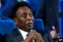 FILE - Brazilian Pele attends the 2018 soccer World Cup draw at the Kremlin in Moscow, Dec. 1, 2017. The 82-year-old sports legend has been hospitalized to regulate the medication in his fight against a colon tumor, his daughter said on Nov. 30, 2022.