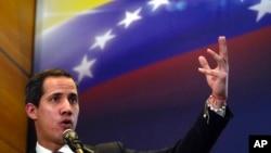 FILE - Opposition leader Juan Guaido explains the income and expenses of his self-proclaimed, parallel government in Caracas, Venezuela, Sept. 16, 2022. 