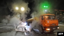 This undated handout photograph released on Dec. 9, 2022 by Kazakhstan's government press service shows workers repairing pipes of the heating system in Ekibastuz.