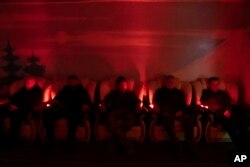 Ukrainian soldiers undergo laser therapy at a rehabilitation center in Kharkiv region, Ukraine, Friday, Dec. 30, 2022. (AP Photo/Vasilisa Stepanenko)