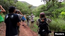 Birdwatchers observe different species in Miramar park guided by members of NGO Pronatura near Jose Cardel, Veracruz, Mexico October 16, 2022. (REUTERS/Carolina Pulice)