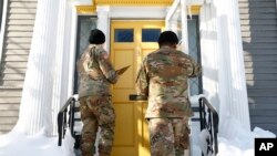 National guard members check on residents, Dec. 28, 2022, in Buffalo NY, following a winter storm.