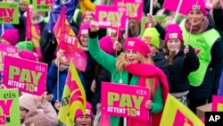 Members of the Educational Institute of Scotland (EIS) join teachers at a rally outside the Scottish Parliament in Edinburgh in a protest over pay, Nov. 24, 2022. 