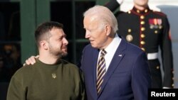 U.S. President Joe Biden welcomes Ukraine's President Volodymyr Zelenskiy on the South Lawn at the White House in Washington, U.S., December 21, 2022.
