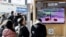 People watch a TV broadcasting a news report on North Korea firing a ballistic missile off its east coast, in Seoul, South Korea, Dec. 18, 2022. 