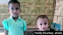 Noor Fatema, 5, and Umme Mah, 3, as photographed on Dec. 1, 2022, in Bangladesh, one day before they boarded the boat for Malaysia with their mother, Ayesha Khatoon. 