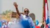 Rwandan President Paul Kagame of the ruling Rwandan Patriotic Front (RPF) waves to his supporters during his final campaign rally in Kigali, Rwanda, Aug. 2, 2017.