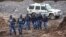 South African police investigate at the scene where more 21 bodies of suspected illegal miners were found near an active mine in Krugersdorp, South Africa, Nov. 3, 2022.