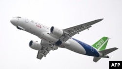 A Commercial Aircraft Corp of China (COMAC) C919 aircraft, China's first domestically produced large passenger jet, performs during the Airshow China 2022 in Zhuhai, in southern China's Guangdong province on Nov. 8, 2022. (Photo by CNS/AFP)