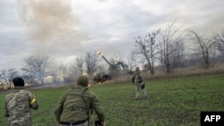 Ukrainian artillery unit members fire at Russian positions towards Kherson city, Oct. 28, 2022, in Ukraine's now Russia-annexed Kherson region.

