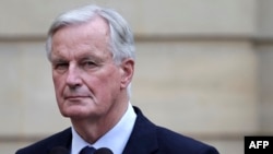 FILE - France newly appointed Prime minister Michel Barnier looks on during the handover ceremony at the Hotel Matignon in Paris, Sept. 5, 2024.