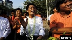 Student activists celebrate outside the prison after being released by the new government's general amnesty in Yangon, Myanmar, April 17, 2016. 