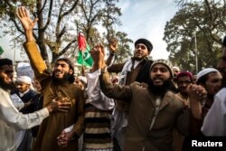FILE - Supporters of Ahl-e-Sunnat Wal Jamaat (ASWJ), a political and religious group, attend a protest in Islamabad, Nov. 22, 2013.