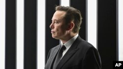FILE - Elon Musk, Tesla CEO, attends the opening of the Tesla factory Berlin Brandenburg in Gruenheide, Germany, March 22, 2022. Musk has offered to buy social media service Twitter. (Patrick Pleul/Pool via AP)