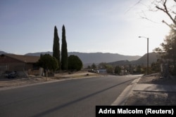 The sun rises near the neighborhoods around the U.S.-Mexico border in Sunland Park, New Mexico, U.S. on March 23, 2022. (REUTERS/Adria Malcolm)