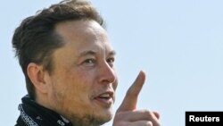 FILE PHOTO: Tesla CEO Musk and CDU party leader Laschet visit the construction site of Tesla's Gigafactory in Gruenheide near Berlin