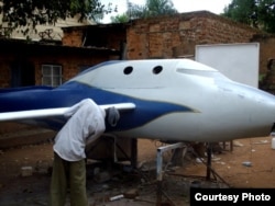 Chris Nsamba and his team work on their projects in his mother's backyard. (Photo: African Space Research Program)